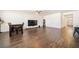 Open living room featuring wood flooring, modern decor, and ample natural light at 2030 Vidalia Ct, Dacula, GA 30019