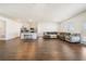 Spacious open-concept living area with wood floors, modern lighting, and a cozy ambiance at 2030 Vidalia Ct, Dacula, GA 30019
