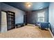 Large bonus room has dark walls, carpet, and an entertainment area at 6119 Hickory Lane Dr, Union City, GA 30291