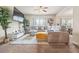 Bright living room with a sectional sofa, large TV, and neutral decor at 6119 Hickory Lane Dr, Union City, GA 30291