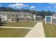 Inviting community entrance with manicured lawn, clear signage, and attractive homes in the background at 2520 Coventry Street, Atlanta, GA 30331
