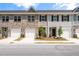 Attractive townhomes with attached garages, brick accents and meticulous landscaping create a welcoming street view at 2520 Coventry Street, Atlanta, GA 30331