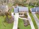 Aerial view of a well-maintained home featuring a long driveway, landscaping, and a neatly manicured lawn at 3167 Northbrook Dr, Atlanta, GA 30341