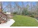 Expansive backyard featuring lush green grass and mature trees, perfect for outdoor enjoyment at 3167 Northbrook Dr, Atlanta, GA 30341