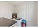 Close-up of bar area with sink, dark countertop, white wall paneling and bar book storage at 3167 Northbrook Dr, Atlanta, GA 30341