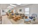 Basement living area featuring white floors, neutral sectional, and a rocking chair at 3167 Northbrook Dr, Atlanta, GA 30341
