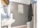 Small bathroom featuring decorative floors, unique sink and mirror with a towel hanging at 3167 Northbrook Dr, Atlanta, GA 30341