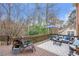 Spacious wooden deck featuring outdoor seating, an umbrella, and a view of the natural surroundings at 3167 Northbrook Dr, Atlanta, GA 30341