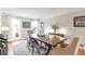 Inviting dining room with hardwood floors, an area rug, a table with seating for six, natural light, and crown molding at 3167 Northbrook Dr, Atlanta, GA 30341