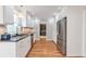 Bright kitchen with white cabinets, granite countertops, stainless steel appliances, and hardwood floors, perfect for cooking at 3167 Northbrook Dr, Atlanta, GA 30341