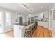 Kitchen with white cabinets, black countertops, stainless steel appliances, large island and bar stool seating at 3167 Northbrook Dr, Atlanta, GA 30341