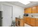 Kitchenette with light wood cabinets, a microwave, sink, and small refrigerator at 3167 Northbrook Dr, Atlanta, GA 30341