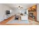 Inviting living room with brick fireplace, hardwood floors, neutral tones, and open layout at 3167 Northbrook Dr, Atlanta, GA 30341