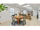 Bright living area with white floors, a dining table set and a tan couch at 3167 Northbrook Dr, Atlanta, GA 30341