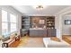 Bright living area featuring built-in cabinets, hardwood floors, bench seating, and neutral wall colors, perfect for relaxing at 3167 Northbrook Dr, Atlanta, GA 30341