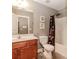 Bathroom with a combination shower and tub and cherrywood vanity at 4273 Creekrun Cir, Buford, GA 30519