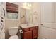 Bathroom with a wood vanity and classic fixtures at 4273 Creekrun Cir, Buford, GA 30519