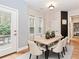 Cozy dining room with a light wood table and patio access at 4273 Creekrun Cir, Buford, GA 30519