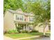 Two-story home with green siding, front lawn, green shutters, and covered front porch at 4273 Creekrun Cir, Buford, GA 30519