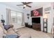 Spacious living room with a comfortable couch, fan and lots of natural light at 4273 Creekrun Cir, Buford, GA 30519