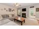 Cozy living room with a fireplace, comfortable seating, and a walk out to the porch at 4273 Creekrun Cir, Buford, GA 30519