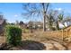 Spacious backyard with a large tree and partial fencing at 1050 Lawton Sw Ave, Atlanta, GA 30310
