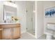 Stylish bathroom featuring a glass shower, vanity and hexagon floor tiles at 1050 Lawton Sw Ave, Atlanta, GA 30310