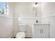 Simple bathroom with a white toilet and vanity at 1050 Lawton Sw Ave, Atlanta, GA 30310