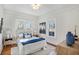 Cozy bedroom with hardwood floors, natural light, and neutral décor at 1050 Lawton Sw Ave, Atlanta, GA 30310