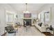 This bright living room features hardwood floors, neutral paint, and a black brick fireplace at 1050 Lawton Sw Ave, Atlanta, GA 30310