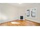 Bright living room with a decorative fireplace and hardwood floors at 1050 Lawton Sw Ave, Atlanta, GA 30310