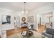 Bright living room boasts hardwood floors, neutral paint, and a modern light fixture at 1050 Lawton Sw Ave, Atlanta, GA 30310