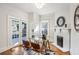 Bright office features a white brick fireplace and French doors to the backyard at 1050 Lawton Sw Ave, Atlanta, GA 30310