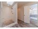 Modern bathroom with a tiled shower stall and sleek fixtures, adjacent to the main bedroom at 170 River Cove Rdg, Social Circle, GA 30025