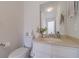 Well-lit powder room features a pedestal sink and neutral tones at 170 River Cove Rdg, Social Circle, GA 30025