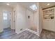 Bright bathroom featuring a walk-in shower with tile surround and built-in shelving at 170 River Cove Rdg, Social Circle, GA 30025
