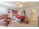 Well-lit bedroom features carpet, sports decor and natural light at 170 River Cove Rdg, Social Circle, GA 30025