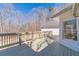 Back deck featuring an entrance to the home with wood railing at 170 River Cove Rdg, Social Circle, GA 30025