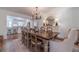Spacious dining room boasts hardwood floors and bright lighting, perfect for gatherings at 170 River Cove Rdg, Social Circle, GA 30025