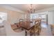 Dining room view showing a kitchen and a staircase, and dining table for entertaining at 170 River Cove Rdg, Social Circle, GA 30025