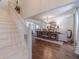 Bright dining room with hardwood floors, stairs and elegant decor for formal entertaining at 170 River Cove Rdg, Social Circle, GA 30025