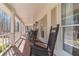 Inviting covered front porch with rocking chairs, perfect for enjoying the peaceful surroundings at 170 River Cove Rdg, Social Circle, GA 30025