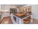 Spacious kitchen features a large center island with seating and modern stainless steel appliances at 170 River Cove Rdg, Social Circle, GA 30025