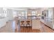 Eat-in kitchen featuring hardwood floors, stainless steel appliances, and center island at 170 River Cove Rdg, Social Circle, GA 30025