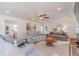 Spacious living room featuring a fireplace, ceiling fan, and comfortable furniture at 170 River Cove Rdg, Social Circle, GA 30025