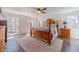 Spacious main bedroom features hardwood floors and large windows at 170 River Cove Rdg, Social Circle, GA 30025