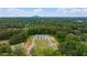 Aerial view of new home construction surrounded by lush green forest and a mountain range in the distance at 3810 Cottage Cir, Clarkston, GA 30021