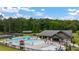 Community pool featuring splash pad, large pool and clubhouse surrounded by lush trees at 3810 Cottage Cir, Clarkston, GA 30021