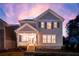 Exterior elevation of a craftsman style home with covered porch, wood stairs, and stone foundation accents at 3810 Cottage Cir, Clarkston, GA 30021