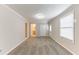 Large bedroom with plush carpeting, and convenient access to the bathroom at 6202 Humphries Hill Rd, Austell, GA 30106